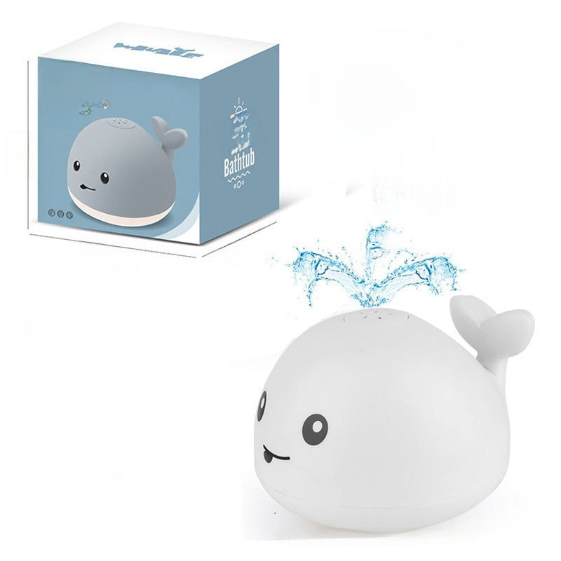 Electric water spouting whale toy