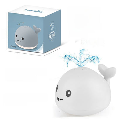 Electric water spouting whale toy