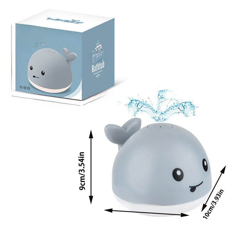 Electric water spouting whale toy
