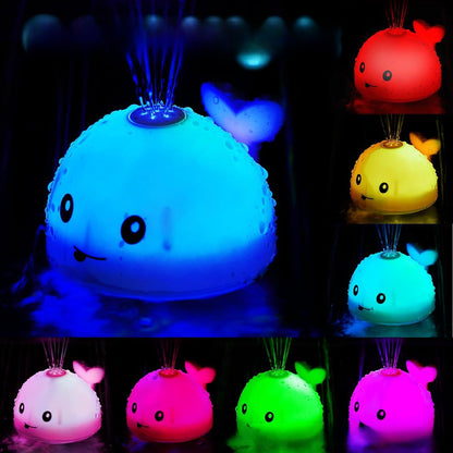 Electric water spouting whale toy